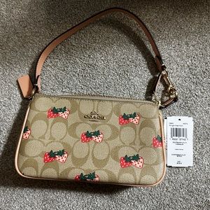 Nolita 19 with strawberry print shoulder bag.